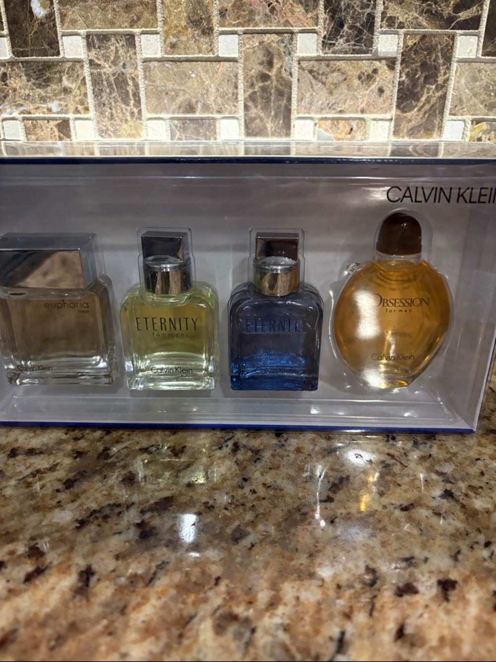 Calvin Klein Men's Mini Cologne Quartet -‎ Amber, Blue, Pale Yellow, Clear